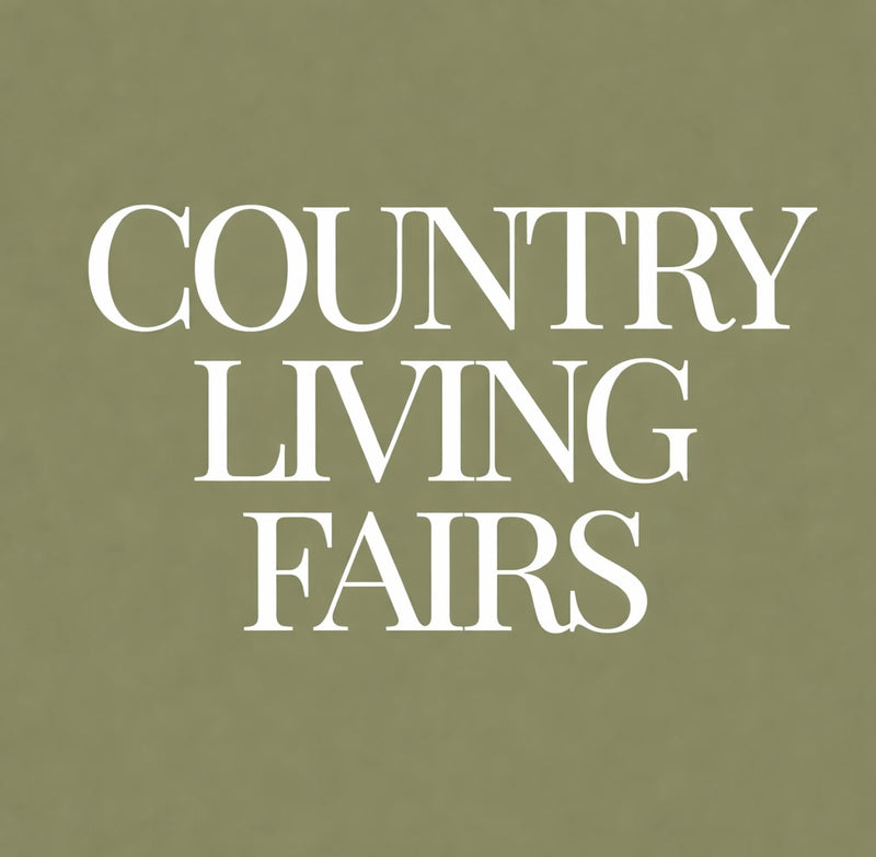 Text 'COUNTRY LIVING FAIRS' on a green background